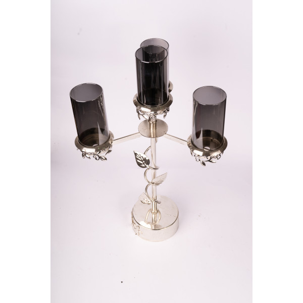 Black and silver candlestick with three candles